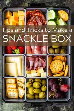 an open lunch box filled with cheese, crackers and meats to make a snack