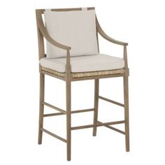 an upholstered bar stool with armrests and seat cushion in beige fabric