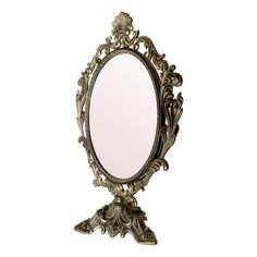 an ornately decorated mirror is shown against a white background