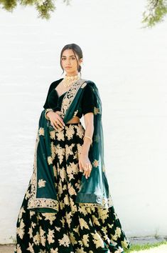 Rimel - Bottle Green Velvet Bridal Lehenga Blouse w/ Jerkin & Zari work Dress to impress! If you wish to turn heads on your big bridal day then this velvet lengha is a must-have. Simple yet elegant green velvet choli blouse Soft-felt velvet fabric blouse Glamorous sweetheart neck Provided with padded support Unique feminine pattern cut Sophisticated elbow-length sleeves Beautiful velvet lengha with Zari & Jerkin handwork Luxurious velvet fabric skirt Gored pattern cut for max flare Opulent golde Green Lehenga With Tilla For Reception, Traditional Velvet Wedding Dress, Fitted Velvet Dupatta For Reception, Anarkali Velvet Sharara For Reception, Anarkali Wedding Velvet Lehenga, Anarkali Velvet Lehenga For Wedding, Anarkali Style Velvet Sharara For Reception, Velvet Traditional Wear With Zari Work For Ceremonies, Velvet Saree For Wedding