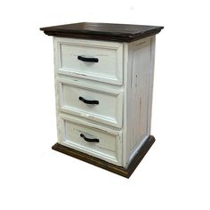 an old white dresser with three drawers on one side and a wooden drawer on the other