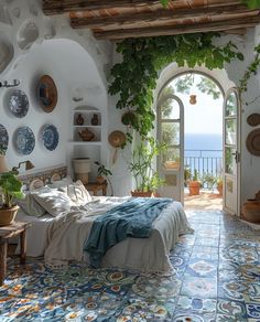 a bedroom with an arched doorway leading to the ocean and plants on the wall above it