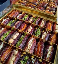 several trays filled with different types of food