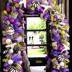 a purple and black wreath with skulls on it