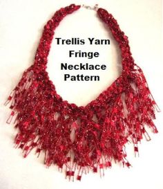 a red necklace with fringes on it and the words, trellis yarn fringe necklace pattern