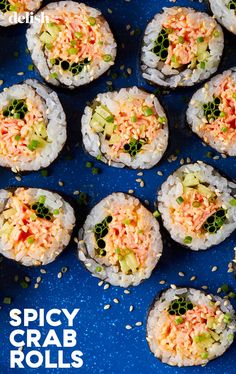 sushi rolls with spicy crab and avocado toppings on a blue plate