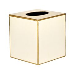 a white and gold square tissue dispenser with a black top on a white background