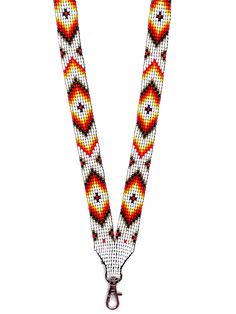 a beaded lanyard with an orange and white design on the front, hanging from a metal hook