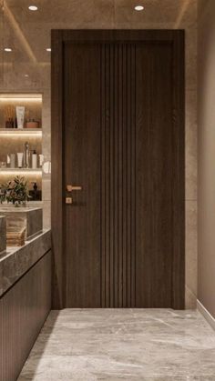 a bathroom with a sink, mirror and large wooden door in the middle of it