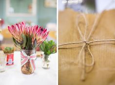 flowers in vases tied to twine and wrapped in brown paper on the table