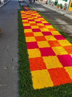 a colorfully decorated walkway on the side of a road