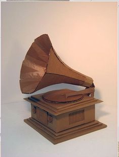 an old wooden record player sitting on top of a box