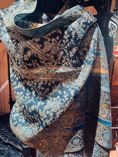 This is one of our favorites and certainly the most popular in a deep jewel tone gold on blue 28 X 70 inch This vintage-styled shawl features our paisley brocade design, styled from ancient Jamawar Kashmiri motifs Very soft and durable silk blend Free shipping in the US Our shawls arrive wrapped in tissue paper in a stylish peacock mailer.  Gift wrap is available. Thank you Etsy community for your support! We are grateful for thousands of great reviews! Festive Formal Pashmina Shawl In Jamawar, Elegant Jamawar Scarves For Festive Occasions, Elegant Jamawar Dupatta Scarf, Elegant Festive Jamawar Scarves, Elegant Blue Paisley Print Scarves, Elegant Embroidered Shawl For Festivals, Elegant Scarves With Traditional Jamawar Patterns, Elegant Jamawar Scarves With Traditional Patterns, Elegant Jamawar Silk Scarf With Traditional Patterns