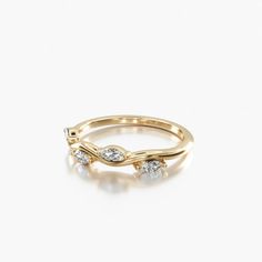 a gold ring with three diamonds on it