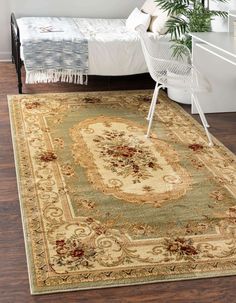 an area rug with a chair and bed in the background