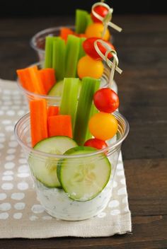 small cups filled with vegetables and dip