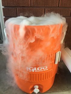 an orange and white cooler with foam on it