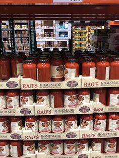 rows of jars of hot sauce on display in a grocery store, with labels reading'hao's homemade '