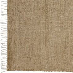 a beige rug with fringes on it