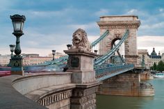 a bridge with a lion statue on it