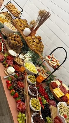 a buffet table filled with lots of different types of foods and desserts on it