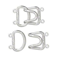 three metal d - rings on white background