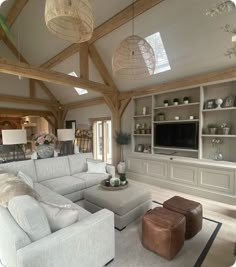 a living room filled with furniture and lots of windows