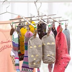 several pairs of socks hanging on a clothes rack