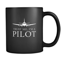 a black coffee mug with the words trust me i'm a pilot on it