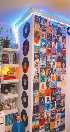 there is a room with many records on the wall and lights in the corner behind it