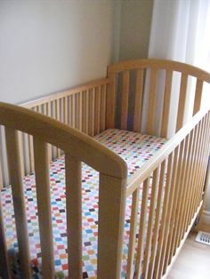 a baby crib in the corner of a room