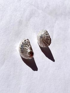 Elevate your style with these exquisite sterling silver handcrafted earrings, artfully shaped like delicate sea shells. Each piece is meticulously crafted, showcasing intricate details that capture the beauty of the ocean. These earrings seamlessly blend elegance and nature-inspired design, making them a timeless addition to your jewelry collection. The artisanal touch ensures uniqueness, adding a touch of sophistication to any ensemble. Dive into the allure of the sea with these stunning sea sh Melted Metal, Melting Metal, Ocean Jewelry, Nature Inspired Design, Wedding Jewelry Earrings, Make A Gift, Handcrafted Earrings, Sea Ocean, Sea And Ocean