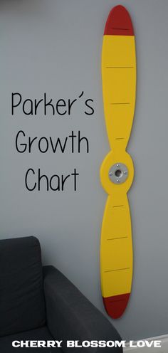 there is a yellow and red growth chart on the wall