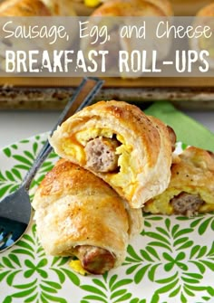 sausage egg and cheese breakfast roll - ups on a plate