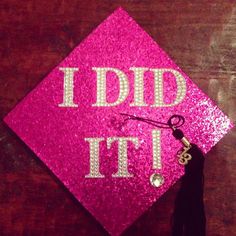 a pink graduation cap that says i did it