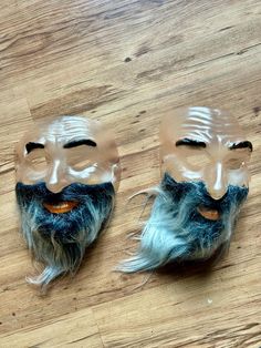 Pair of 2 Vintage Topstone Industries Molded Plastic Masks With Beard Hair - Halloween Mask - Vintage Halloween - Halloween Decor - Beard Mask - Halloween Costume Mask is see-thru tinted molded plastic with a fake fur beard.  The eyes and nostrils are cut out. The plastic is in good shape. Doesn't seem brittle. There is still some flexibility. The eye brows and mouth is colored in the plastic. Cheeks and mouth have a pinkish-red tint. The elastic is attached with bent flat wire. The plastic masks measure 8 inches high and 7 1/2 inches wide at the widest point -  The beard is about 8 inches. Tags are marked: "Topstone Industries, Inc, Danbury, Conn #1817 (beard) Made in Korea" These vintage masks are great for props at your Halloween party and sure are conservation pieces for those of us wh Vintage Masks, Plastic Mask, Halloween Costume Mask, Hair Halloween, Flat Wire, Eye Brows, New Children's Books, Beard Hair, Mask Halloween