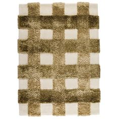 an area rug with squares on it in brown and white colors, made up of various materials