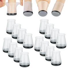 a set of twelve glass cups with wooden handles and black rims are shown in front of each other