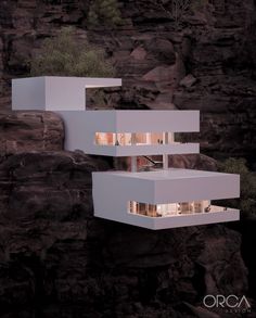 an image of a house built into the side of a cliff