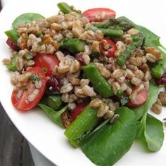 a white plate topped with salad and veggies