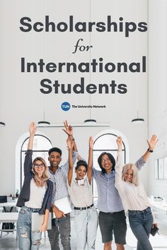 group of people raising their hands in front of a sign that says,'scholarships for international students '