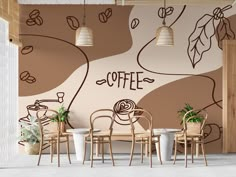 there are many chairs and tables in the room with coffee wall mural on the wall