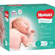 a box of huggies new born diapers with a baby sleeping on it's back