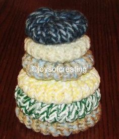 four crocheted coasters stacked on top of each other