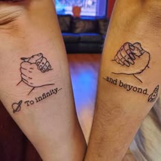 two people with tattoos on their arms holding each other's hands and saying, no infinity