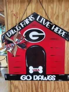 "This Georgia Bulldog House Door Hanger is 22 x 22\".  It is all 3d pieces glues and brad nailed down onto the .25 wood.  These make terrific gifts.  Please check out my Facebook page at @thewoodshedadel" Class Door Decorations, Bulldog Football, Hanger House, Georgia Bulldog, Calligraphy Signs, Burlap Door Hangers