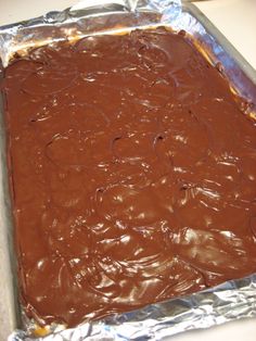 a pan filled with chocolate cake sitting on top of a counter