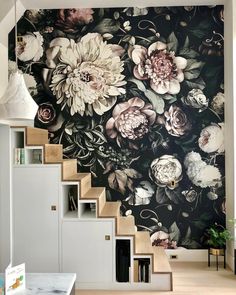 the stairs are decorated with floral wallpaper