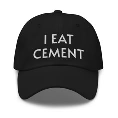 a black hat with the words i eat cement printed on it