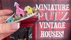 a hand holding a miniature house made out of felt with the words miniature putz vintage houses on it